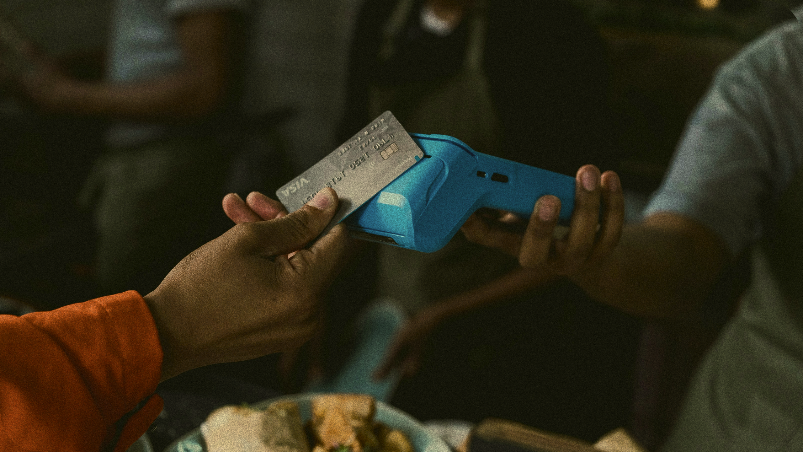 A customer paying by card at a Flynet merchant